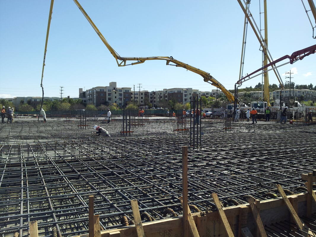 Steeltech crew placing a reinforcing steel mat ahead of a concrete pour